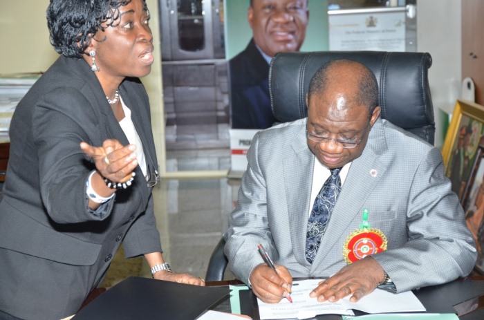 The Minister of Power, Chinedu Nebo (Professor) signing the MoU with a Alpha Energy and Electric, Inc., Kansas City, Missouri, USA on December 16, 2014 for development of Rural Off-Grid Solar Electrification, Off-Grid (Embedded) and Grid-Connected Electricity in Nigeria